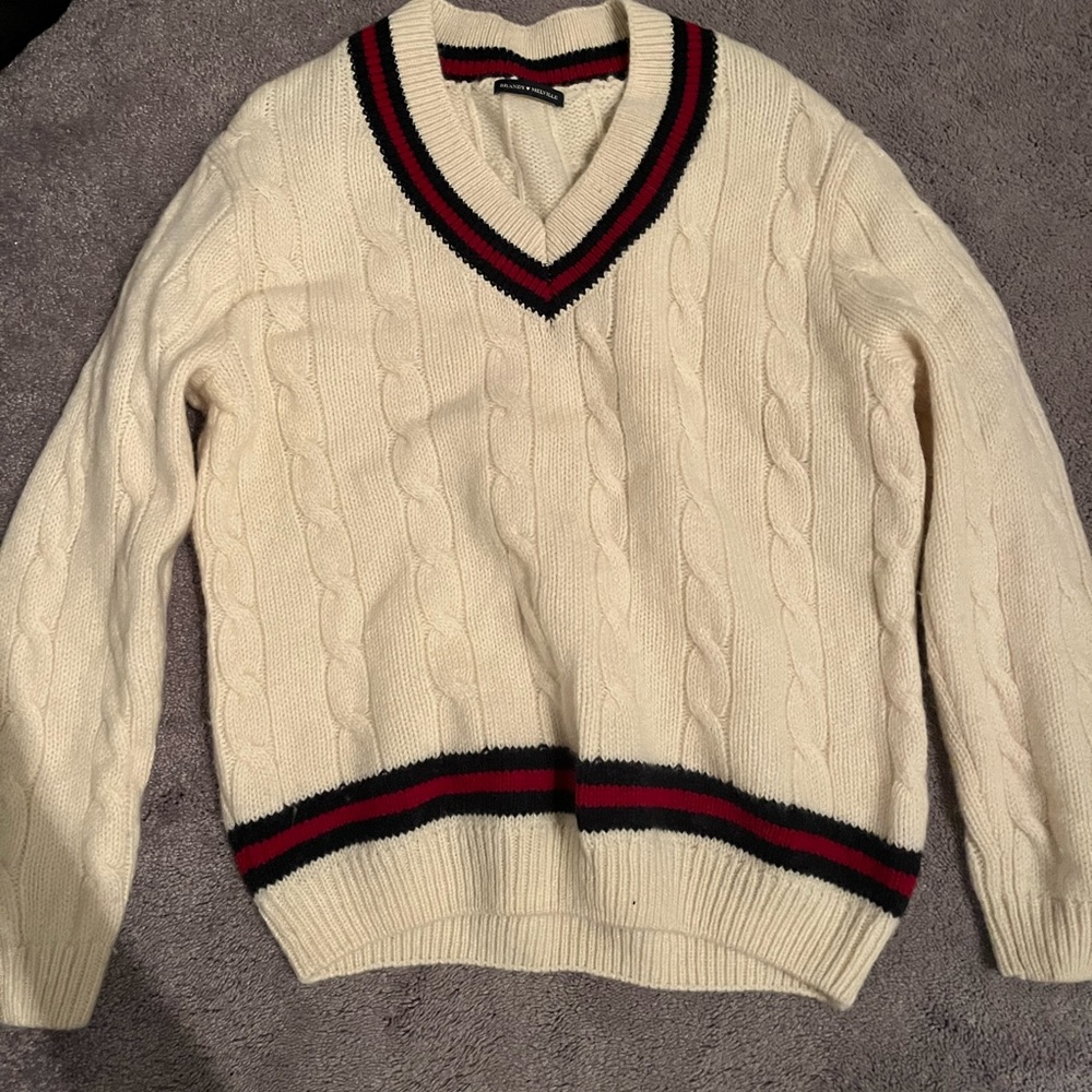 Cream oversized V neck sweater with red and navy trim